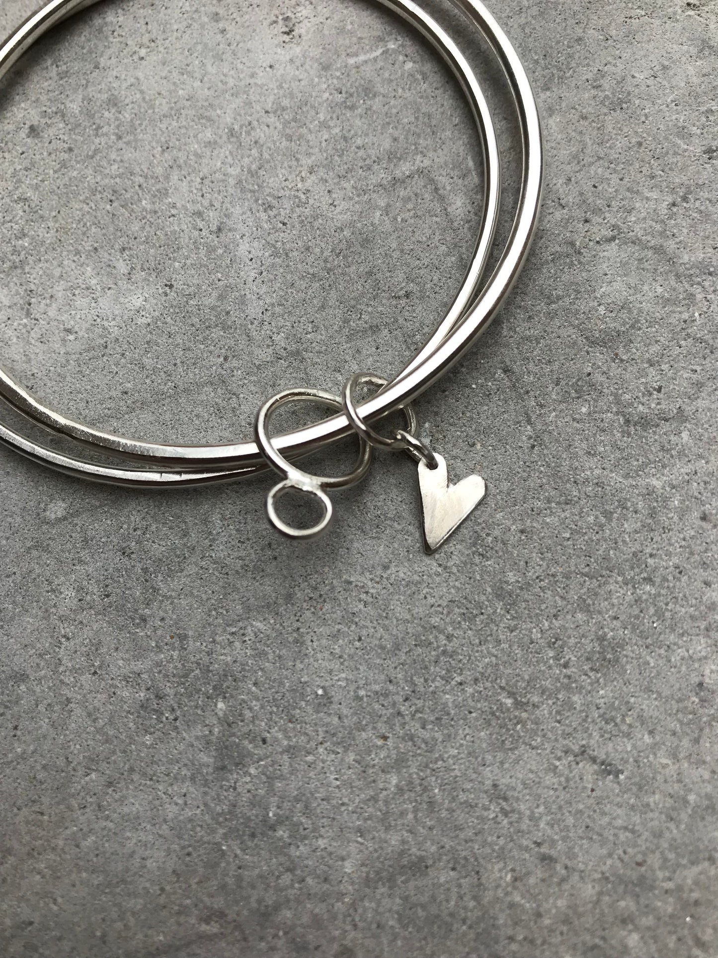 Sterling Silver Double Bangle with Heart and Hoops Charms.